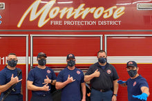 Montrose firefigthers wearing face-mask made by SOM footwear
